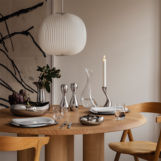 Cobra 2021 image with mirror polished stainless steel candle holder, carafe, bowl and plates