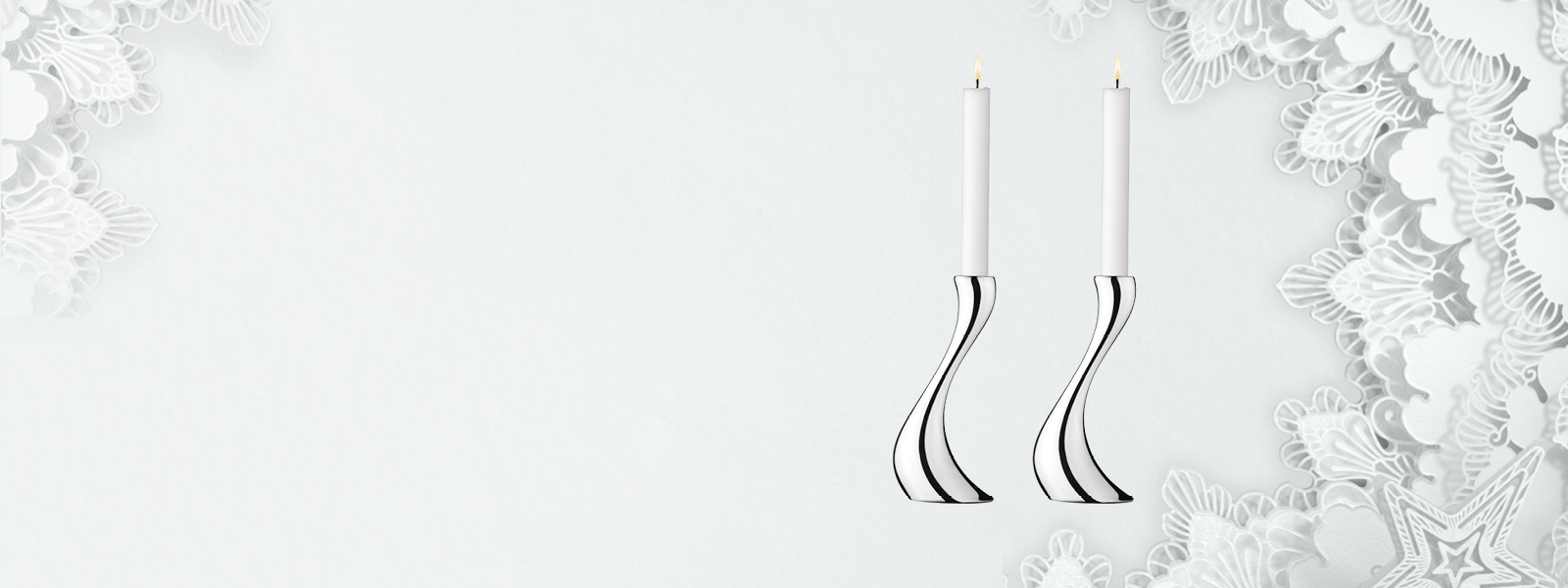 Christmas 2021 campaign banner featuring mirror polished stainless steel candle holders from the Cobra collection