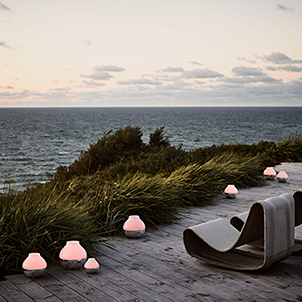 Mirror polished stainless steel and frosted glass candleholders from the Hurricane collection inspired by Henning Koppel