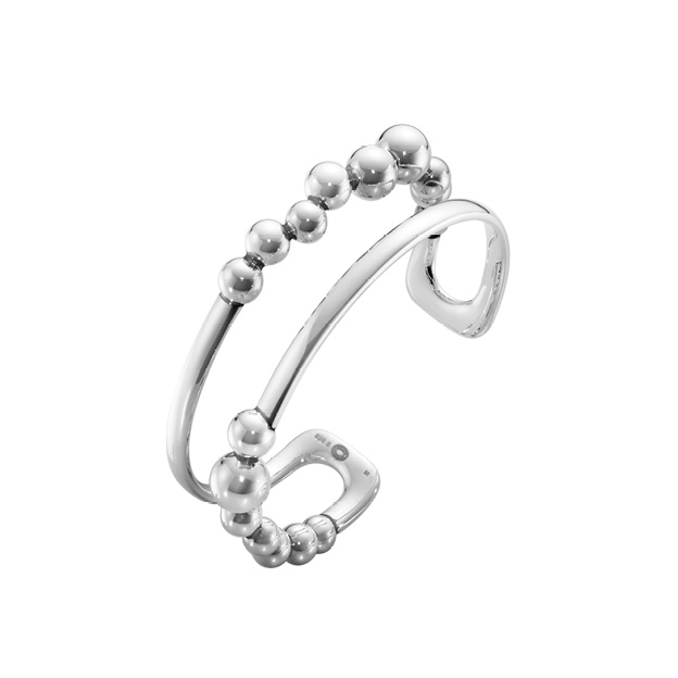 Sterling silver grapes inspired bangle pack shot from the Moonlight Grapes collection by Georg Jensen