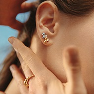 18 kt. yellow gold, white gold and diamonds ring and earstuds on model from the Moonlight Grapes collection by Georg Jensen