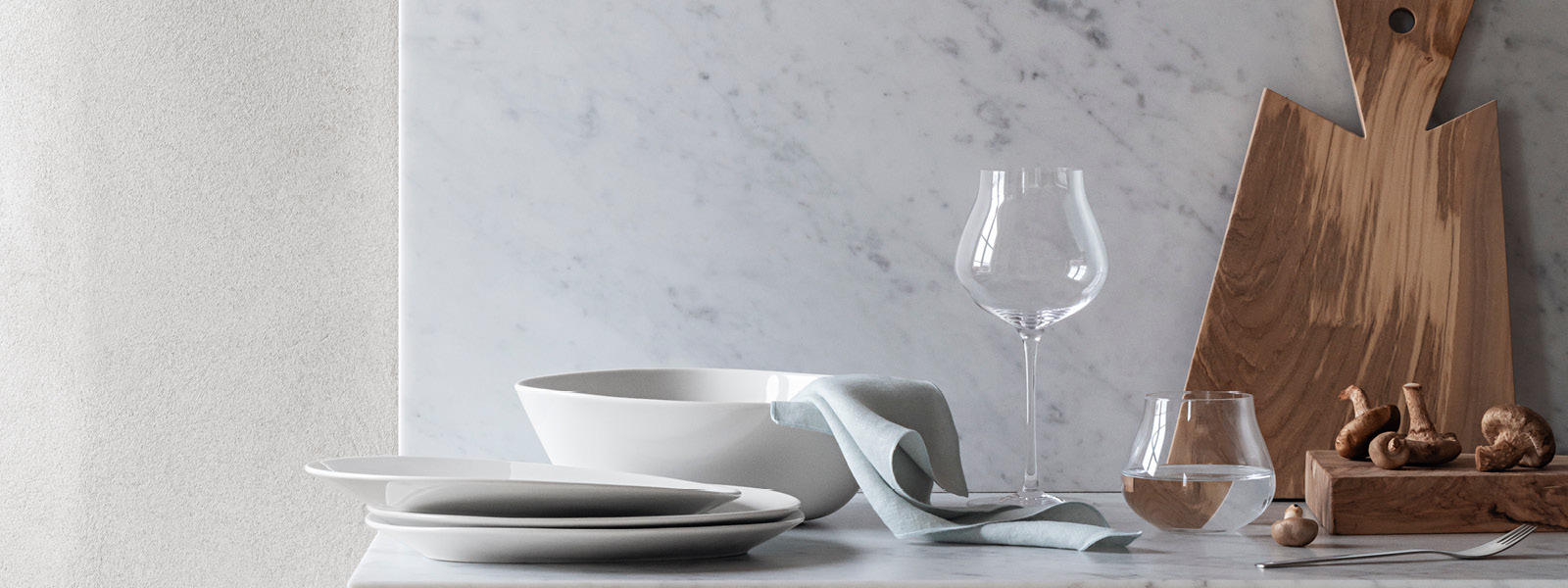 Sky collection porcelain bowls, plates and crystal clear glasses still life image