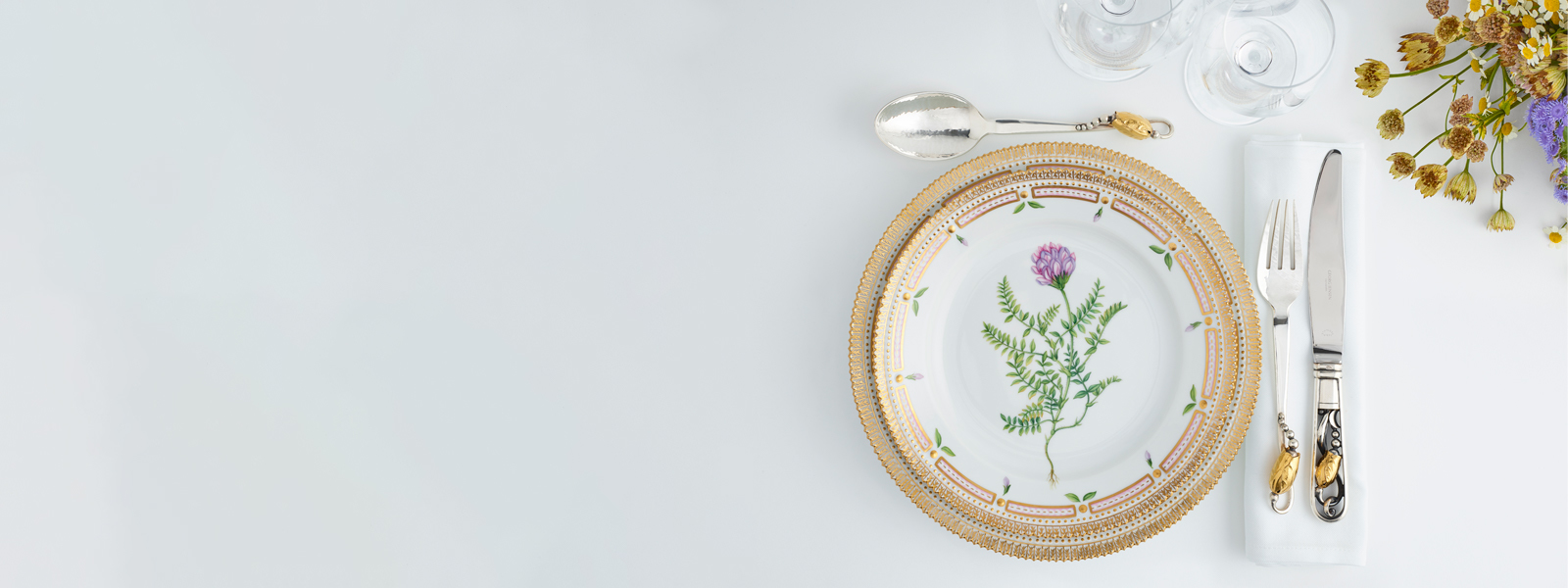 Fine sterling silver and 18 kt. gold cutlery knife, fork and dessert spoon from the Magnolia collection by Georg Jensen