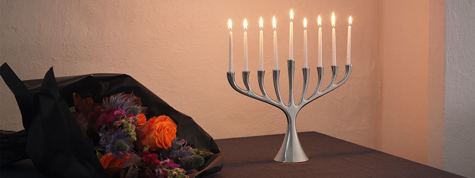 Mirror polished stainless steel Menorah candleholder from the Cobra collection